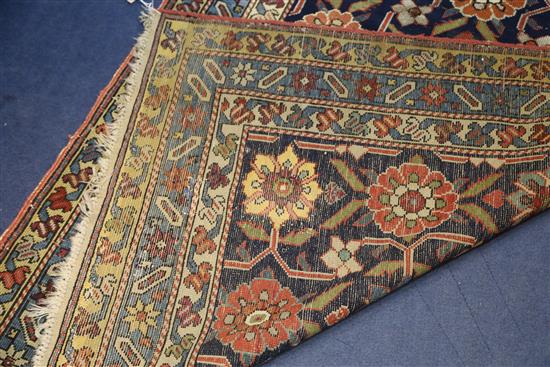 A Caucasian blue ground runner, 13ft 2in by 3ft 8in.